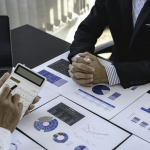 business adviser meeting to analyze and discuss the situation on the financial report in the meeting