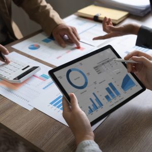business adviser meeting to analyze and discuss the situation on the financial report in the